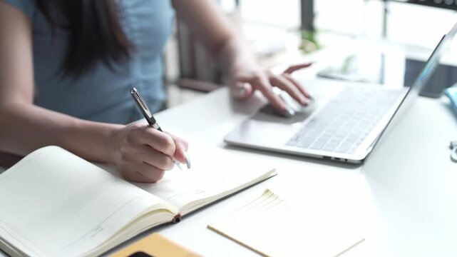Asian Female University Student Studying Online on Laptop