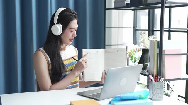 Asian Female University Student Studying Online on Laptop