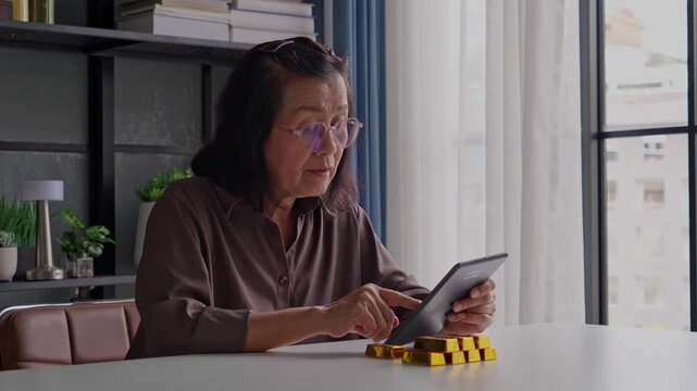 Elderly Asian woman plans retirement, invests in gold bars