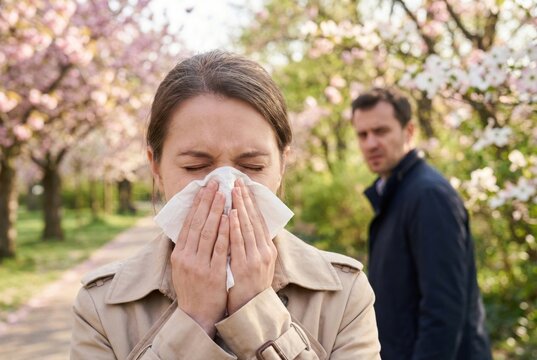 woman allergic to blooming tree in garden
