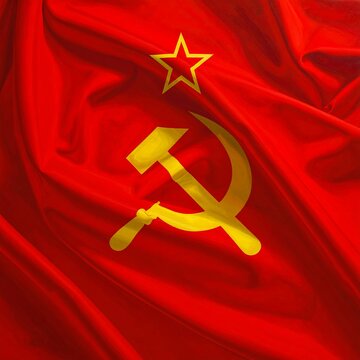 A vibrant red flag with a yellow hammer and sickle