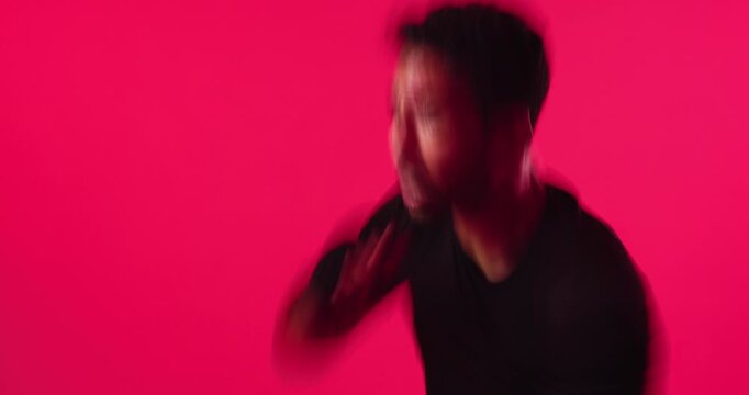Exercise, boxing and man in studio for training, self defense or workout on red background. Sports, athlete and person with gloves for competition, fitness or practice for wellness, energy or routine