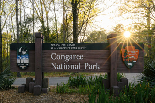 Congaree National Park entrance sign with National Park Service logo at sunset, South Carolina, USA &ndash; April 2022. 