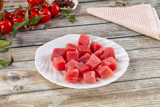 Raw tuna fish cubes heap
