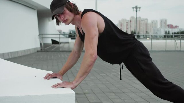 young man doing push ups in gym