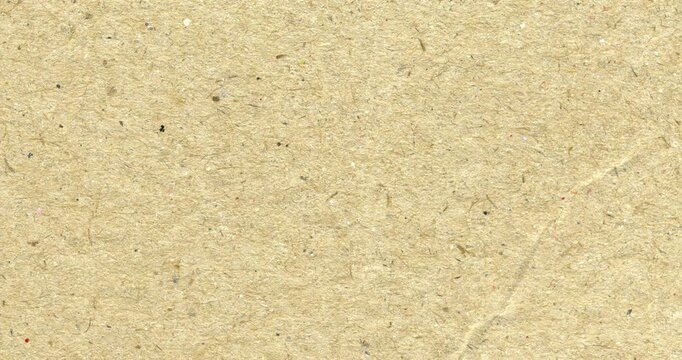 Yellow kraft paper noise texture stop motion video. Aged paper overlay effect background loop animation. Vintage paper texture with stains, grain, dust particles. Empty animated background