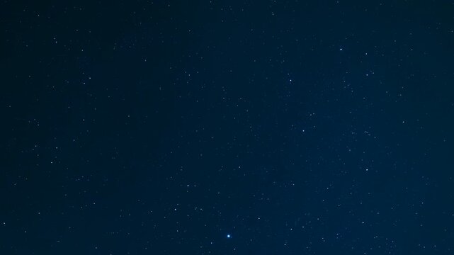 Aesthetic night scape with beautiful shimmering stars and celestial nebula in the deep blue universe
