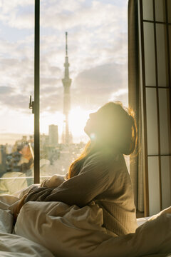 Woman at Sunrise with the Tokyo Sky Tree View During Sunrise