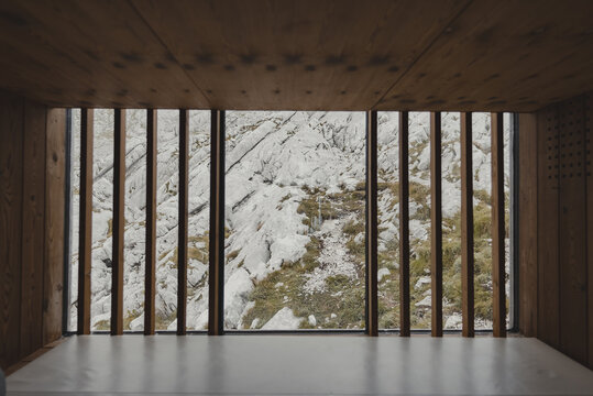 View of mountains from inside a modern alpine shelter