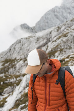 Hiker looking down at a mountain view