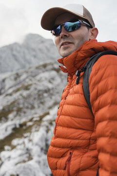 Portrait of a hiker smiling on a mountain