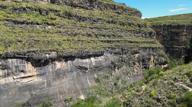 Aerial turns corner in steep, deep rock canyon gorge, Torotoro Bolivia
