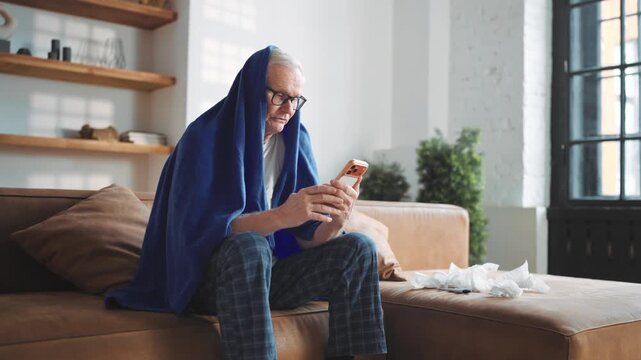 Elderly man feeling pain in chest calling by video in smartphone to doctor. Portrait of senior sick male person caught cold or heart attack, suffering of lung ache, telemedicine and modern technology