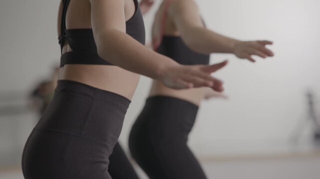 Young talented girls tap dancing routine in a modern dance studio