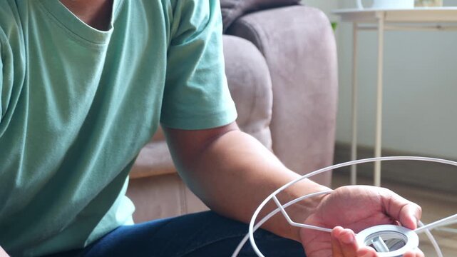 Young asian man Cheking completeness of floor lamp