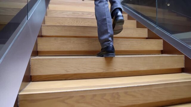 Confident businessman with High Spirits Ascending the Stairs, climbing the ladders to success. concept of career path success, future planning and business competitions