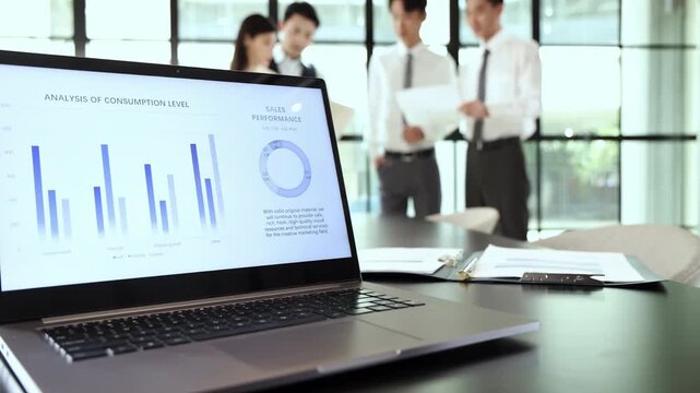 Successful group business professionals colleagues in a modern conference coffice meeting. They are exchanging ideas, discussing data analysis, reviewing reports, formulating strategies future growth