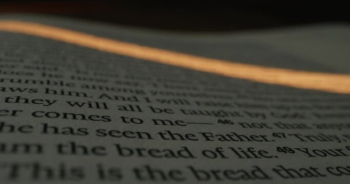 A detailed view of text on a page, highlighting specific words and phrases. The focus shifts across the lines, emphasizing the content.