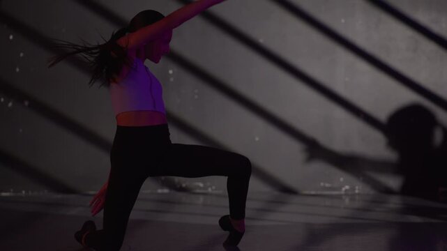 Young modern girls in dance class performing