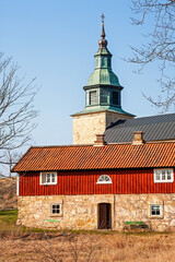 Old rustic Stone house with a steeple in the background © Lars Johansson