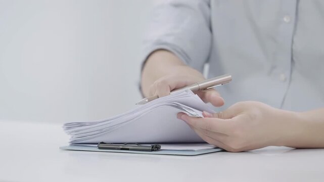Home insurance broker or salesman agency recheck detail on document before sign contract. Selling houses Real estate and property concept.