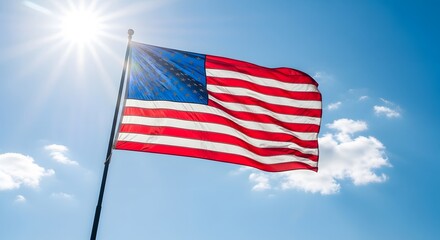Obraz premium American flag waving in the wind on a sunny day