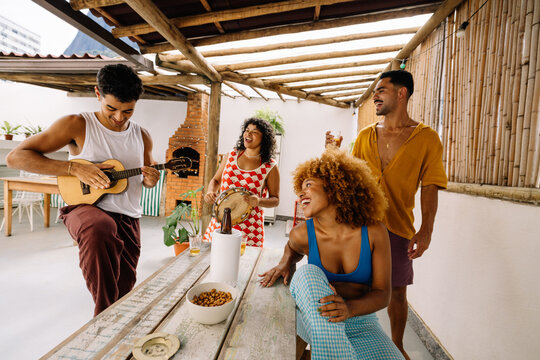 Friends enjoying a roda de samba gathering in Rio de Janeiro