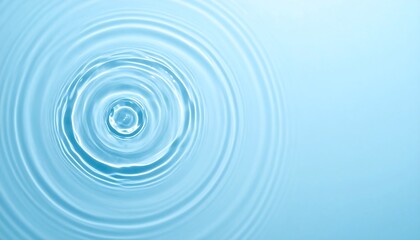 Graceful concentric water ripples expanding outwards on a clear, vibrant blue liquid background, offering a peaceful and mesmerizing abstract pattern
