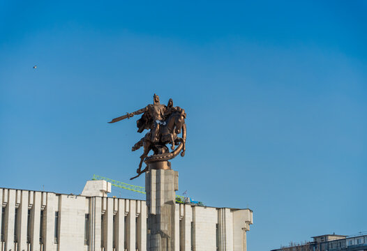 Manas Equestrian Statue Above Philharmonic Hall Bishkek Under Clear Blue Sky