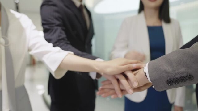 Successful business people putting their hands together make inspiration, motivating encouraging, instilling enthusiasm, boosting morale boosting teamwork and collaboration, group partnership energy