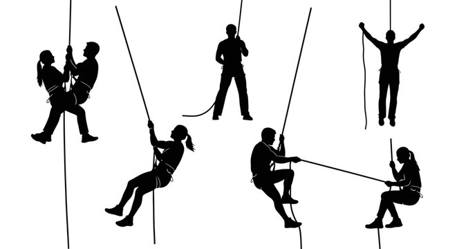 Silhouette climbers rappelling and climbing rock wall with ropes, active lifestyle and extreme sports concept