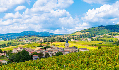 Naklejka premium Travel destination in France, Rural village in vineyard in Burgundy, beaujolais