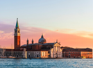 beautiful view at Abbey of San Giorgio Maggiore from San Marco square in Venice, Italy. Venetian sunset landscape of antique architecture. © Yaroslav