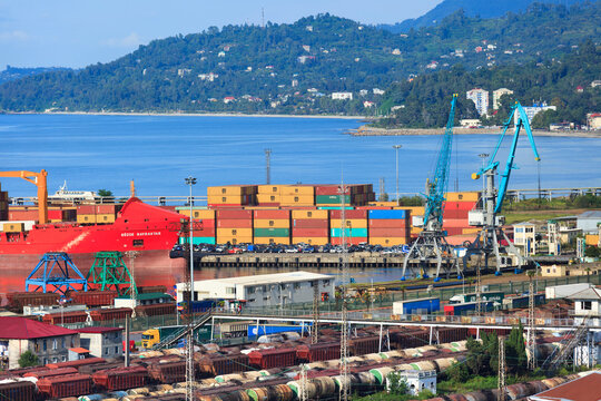 Batumi, Georgia - September 09, 2014: Cargo terminal in Batumi with container ship and cranes. Logistics hub for international trade, container storage, and freight transportation by sea and rail.