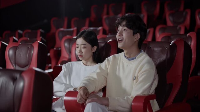 Young couple moviegoer watching movie in empty cinema theater auditorium, unpleasant negative emotion bored girl fall asleep missing boring film, boys watching with great interest