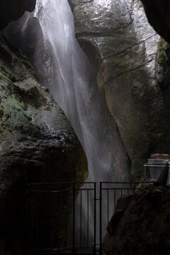 Cascate Varone waterfall in gorge with natural light and wet rock walls in underground cave parco grotta Trentino Italy