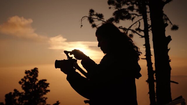 Photographer silhouette at sunset on Acatenango volcano Guatemala