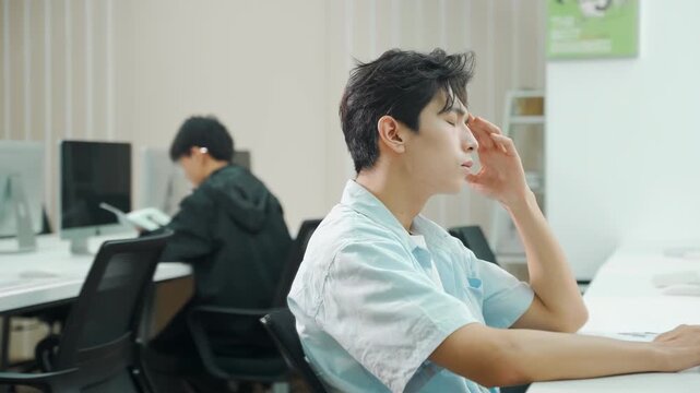 Office worker businessman feeling stressed and depressed, overworked overtime work feel pain man holding his painful head down, feeling bad, suffering from chronic job, anxiety, depression, low Spirit
