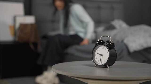 Morning of hurrying overslept young woman waking up to missed alarm near bed, getting late work, morning stress, getting out of bed in a hurry running late for work, appointment or class study