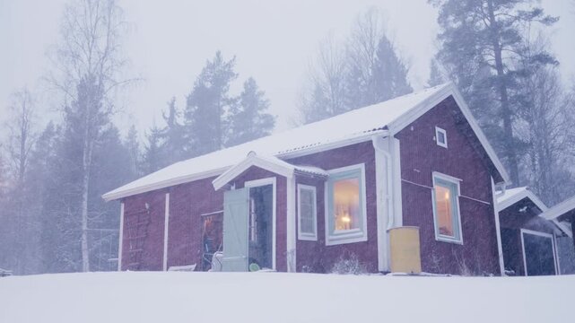 Extreme snowfall around falu Swedish off-grid house in woods in winter