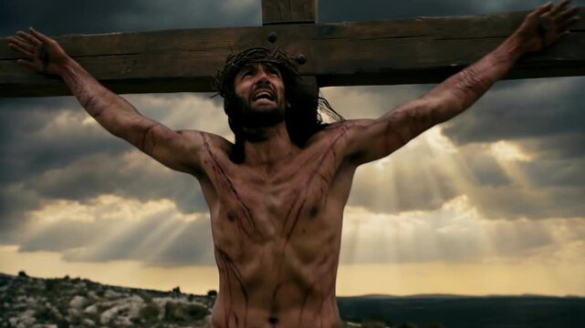 Jesus Christ and two men crucified on crosses with dramatic sky at twilight during passion week on good friday