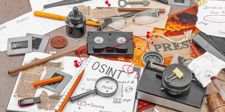 Modern OSINT and digital investigation concept with vintage tools, magnifier, notepad, documents
