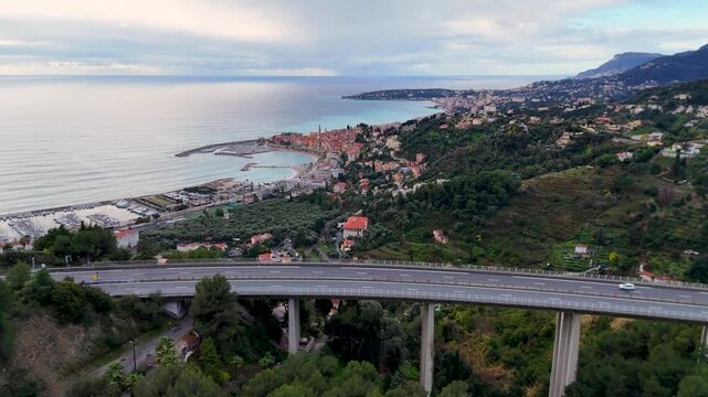 Aerial view of highway viaduct and menton seascape