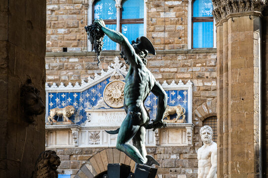 Perseus with the Head of Medusa statue by Cellini and David by Michelangelo in Piazza della Signoria, Florence, Italy