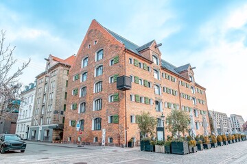 Naklejka premium Historic Red Brick Warehouse Building in Nyhavn Copenhagen Denmark