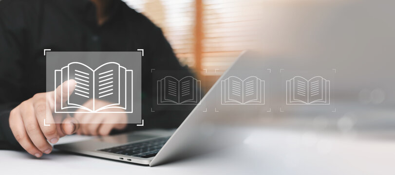 Digital e learning and online knowledge concept with person using laptop and virtual book interface, representing online education platform, digital library access, remote study, modern educational