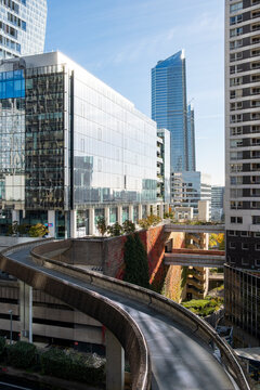 Sweeping curved overpass and towers in La Defense Paris France showcasing modern urban infrastructure architecture and strong perspective in the business district