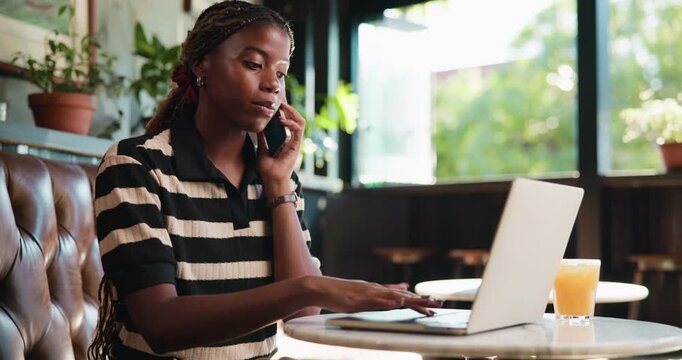 Black woman, talk and phone call with laptop at cafe for discussion, planning and contact editor. Person, freelancer or explain with mobile for conversation, interview source and chat for publication