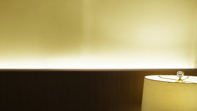 Minimalist Bedroom with Indirect Headboard Lighting and Modern Table Lamp