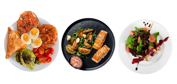 Assorted Healthy Gourmet Meals with Grilled Salmon, Boiled Eggs, Avocado, and Fresh Salads Isolated